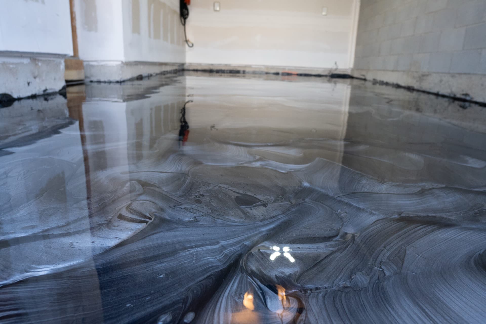 Close detail of cured metallic epoxy showing silver and charcoal marbling