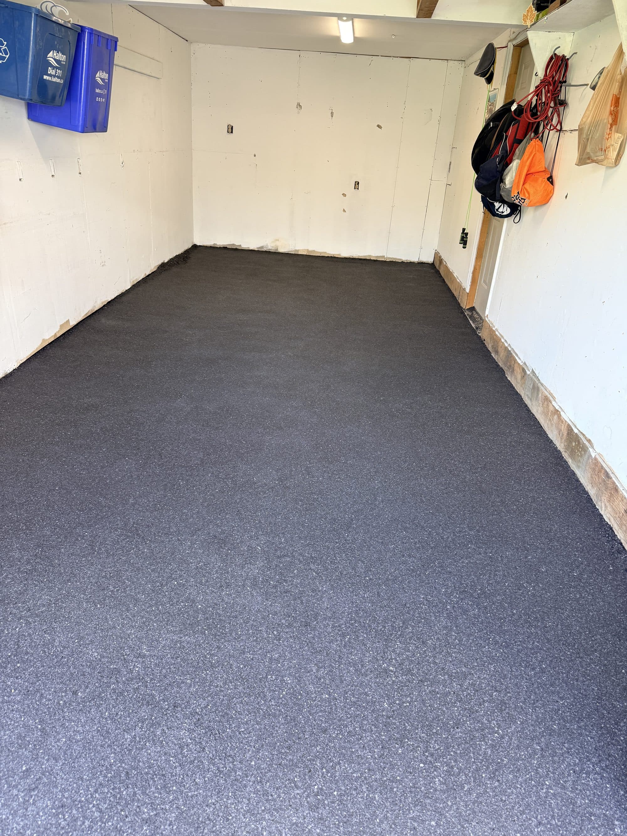 A large charcoal flake epoxy workshop floor of the size common on Georgetown properties