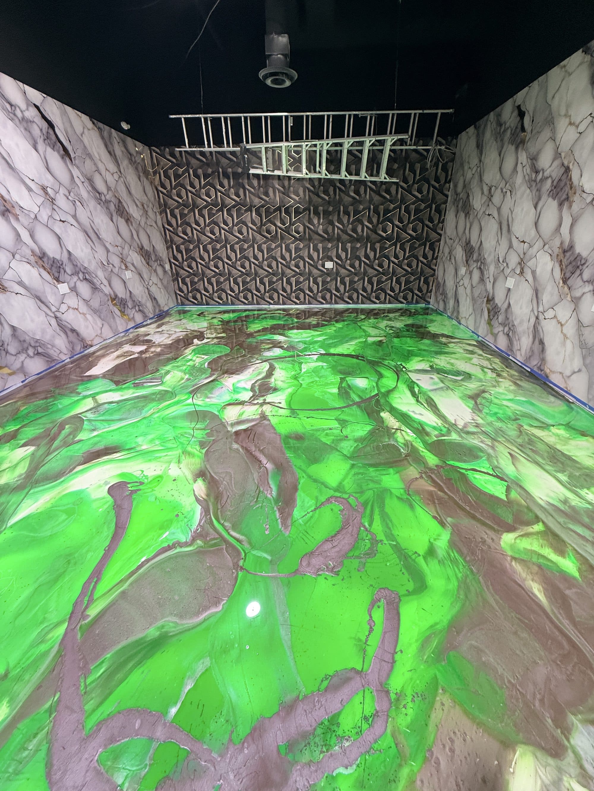 Emerald metallic epoxy poured across a commercial unit floor in the Mississauga area